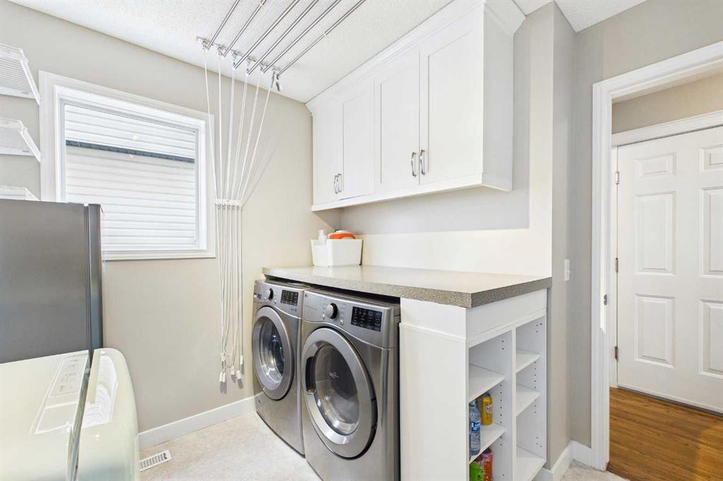 149 Tuscany Ravine Bay Nw, Calgary, AB - Indoor Photo Showing Laundry Room