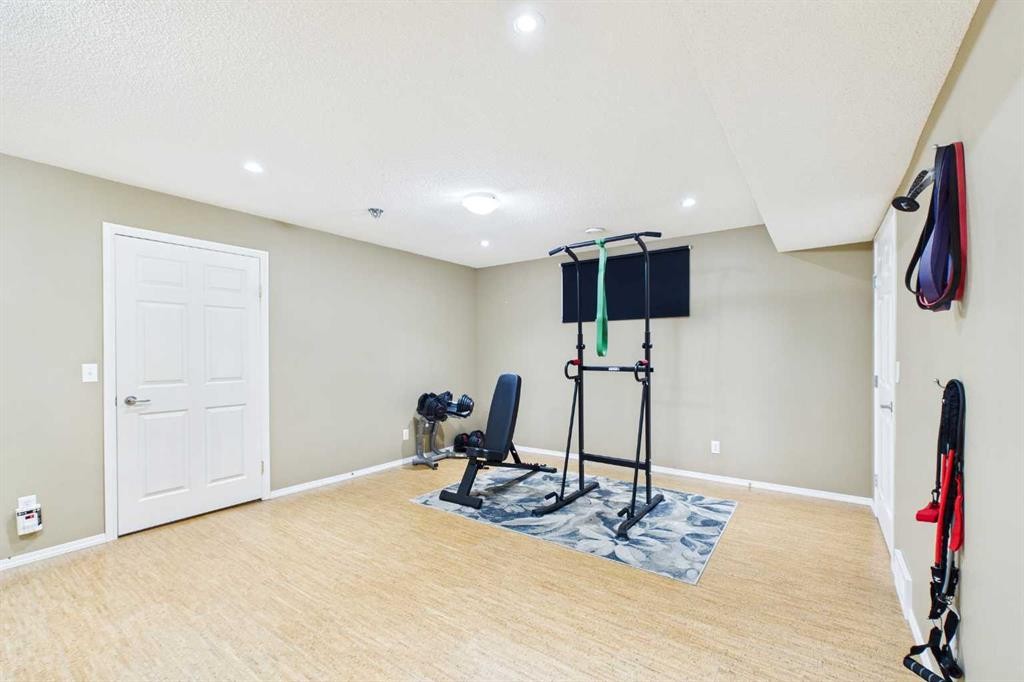 149 Tuscany Ravine Bay Nw, Calgary, AB - Indoor Photo Showing Gym Room