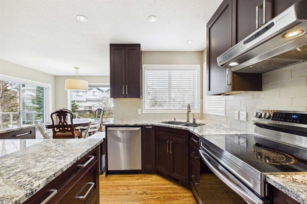 149 Tuscany Ravine Bay Nw, Calgary, AB - Indoor Photo Showing Kitchen With Double Sink With Upgraded Kitchen