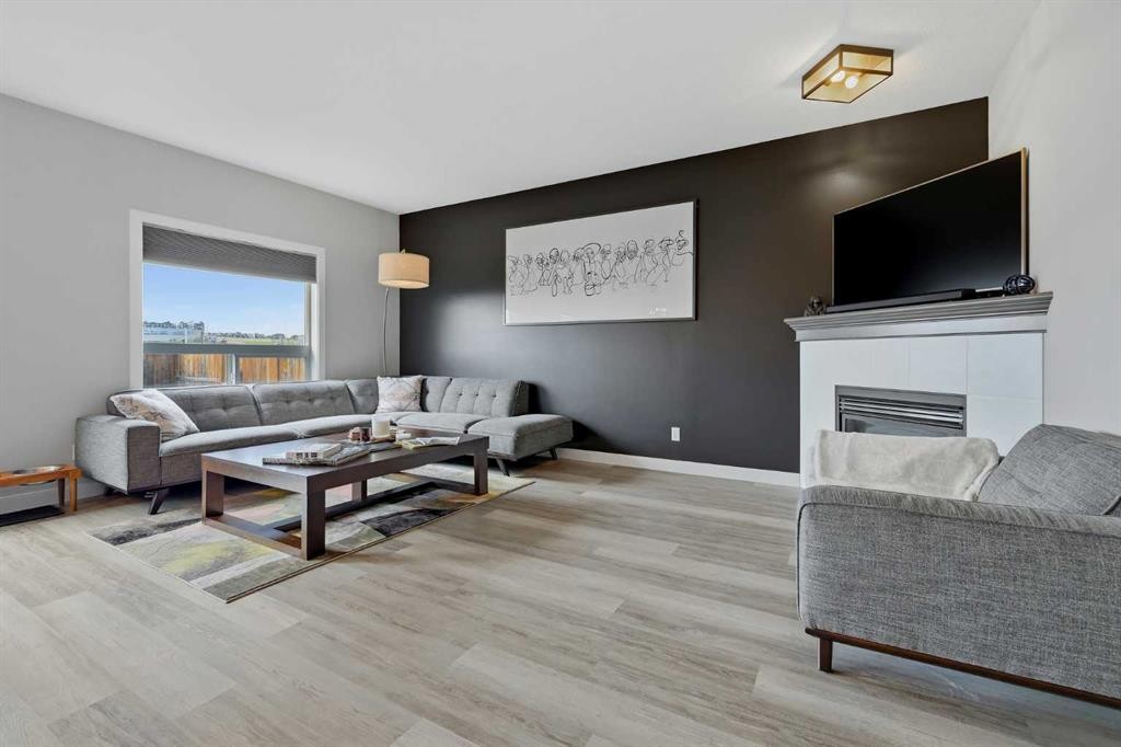 115 Everwoods Park Sw, Calgary, AB - Indoor Photo Showing Living Room With Fireplace