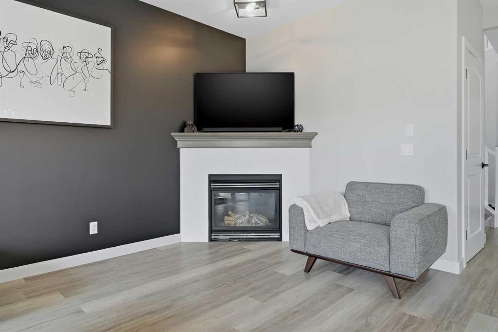 115 Everwoods Park Sw, Calgary, AB - Indoor Photo Showing Living Room With Fireplace