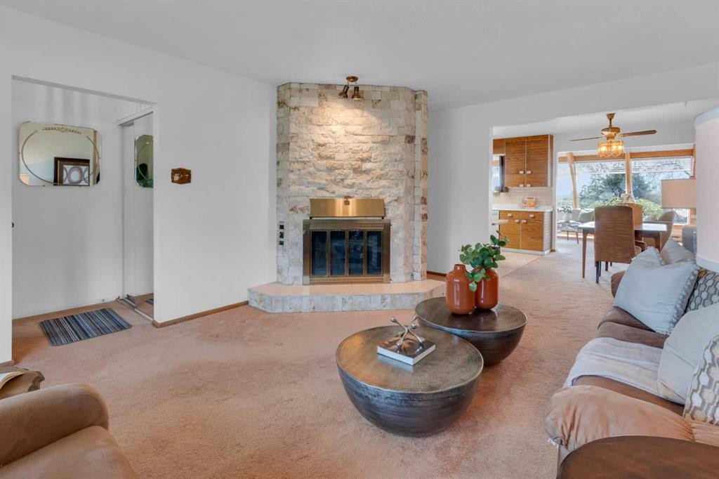 1031 Thorneycroft Drive Nw, Calgary, AB - Indoor Photo Showing Living Room With Fireplace