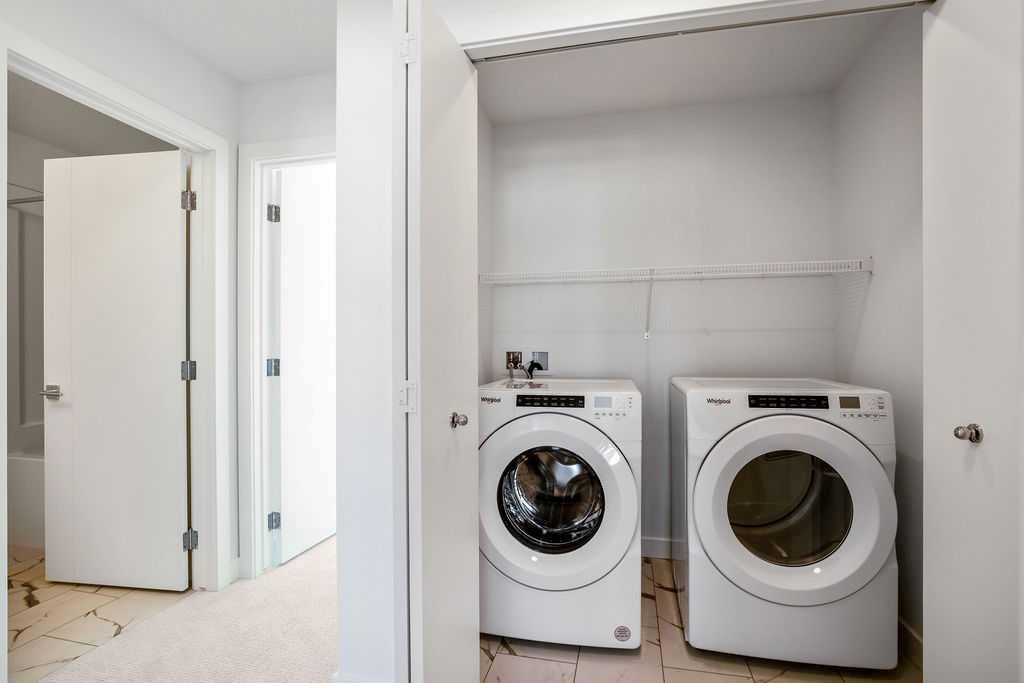 207-50 Cornerstone Passage Ne, Calgary, AB - Indoor Photo Showing Laundry Room