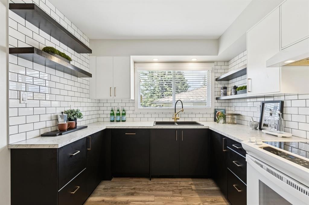 48 Haddock Road Sw, Calgary, AB - Indoor Photo Showing Kitchen With Double Sink With Upgraded Kitchen