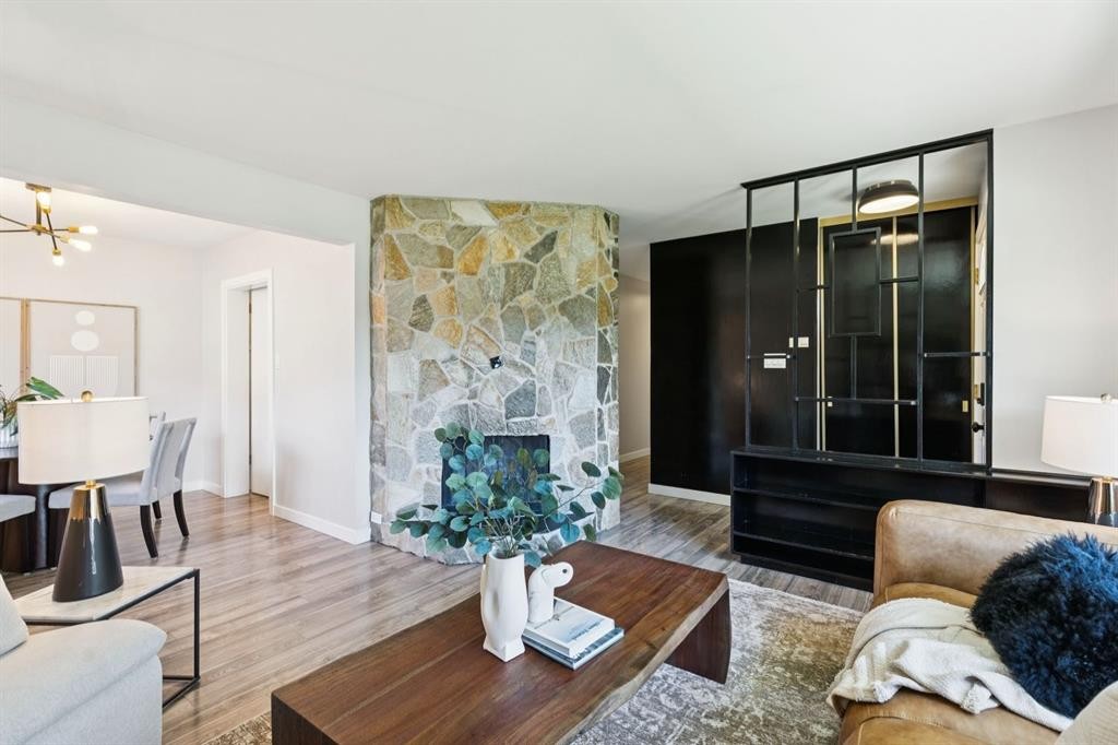 48 Haddock Road Sw, Calgary, AB - Indoor Photo Showing Living Room With Fireplace