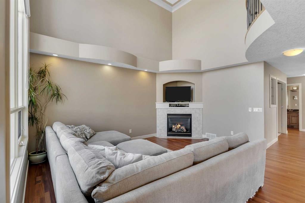 273 Everglade Circle Sw, Calgary, AB - Indoor Photo Showing Living Room With Fireplace