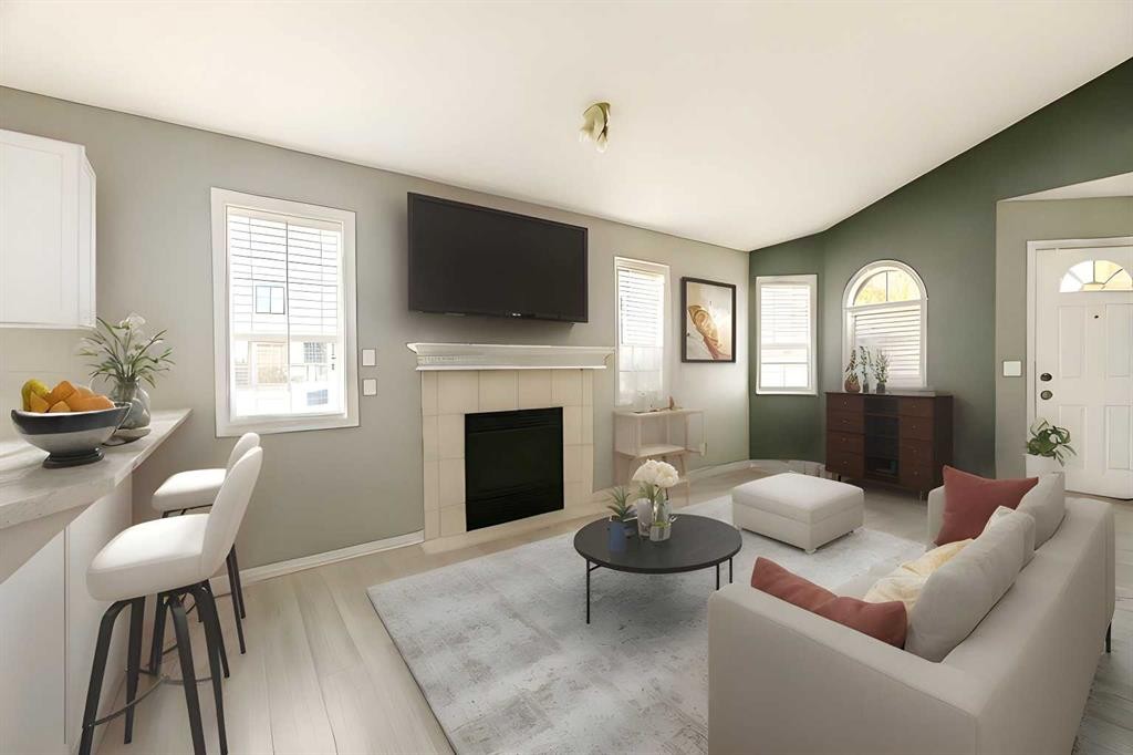 101 Channelside Cove Sw, Airdrie, AB - Indoor Photo Showing Living Room With Fireplace