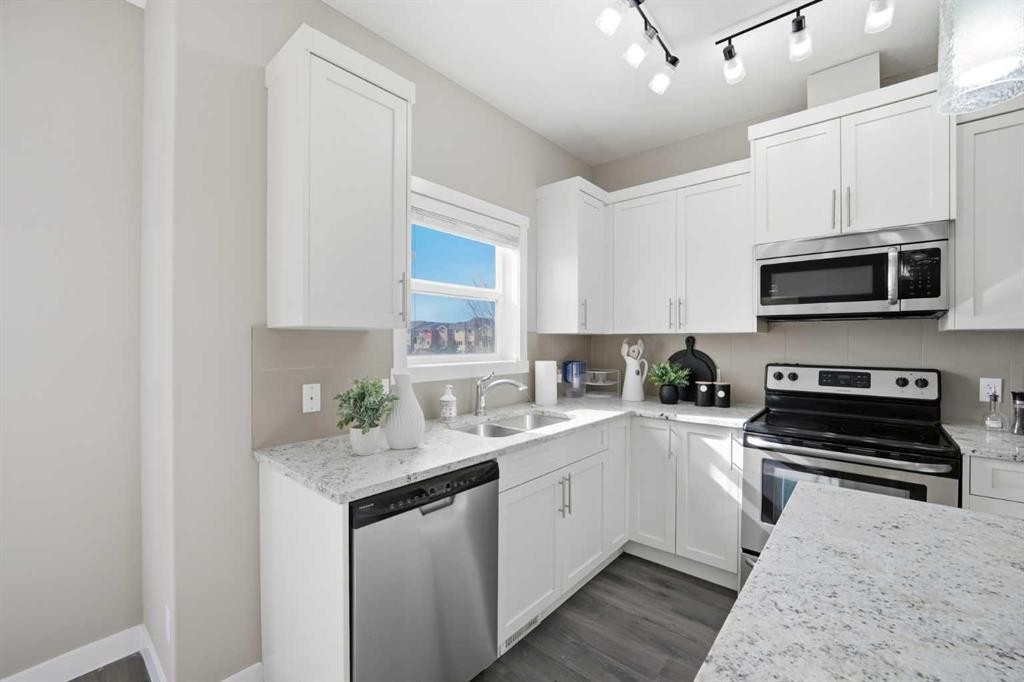 556 Redstone View Ne, Calgary, AB - Indoor Photo Showing Kitchen With Stainless Steel Kitchen With Double Sink