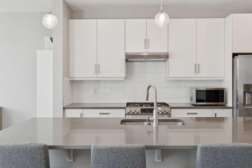 52 Mahogany Way Se, Calgary, AB - Indoor Photo Showing Kitchen With Double Sink With Upgraded Kitchen