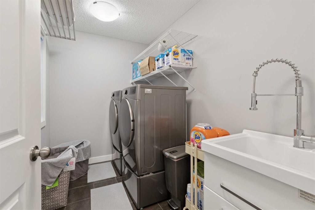 52 Mahogany Way Se, Calgary, AB - Indoor Photo Showing Laundry Room