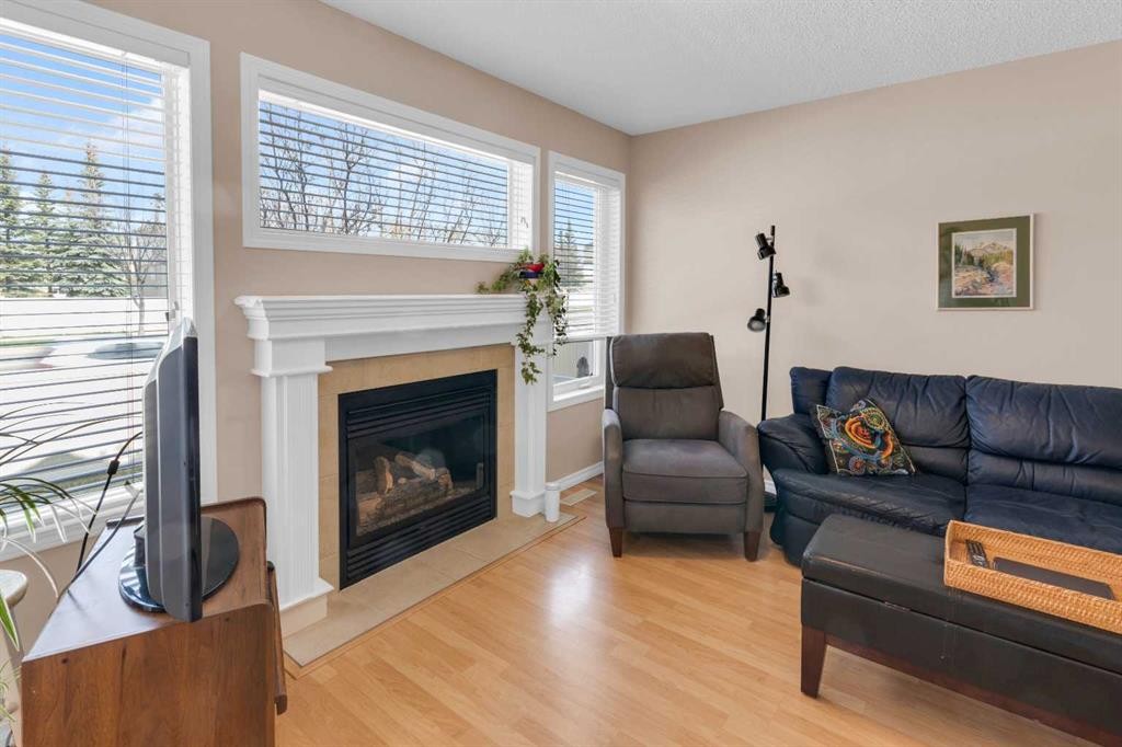 27 Royal Birch Mount Nw, Calgary, AB - Indoor Photo Showing Living Room With Fireplace