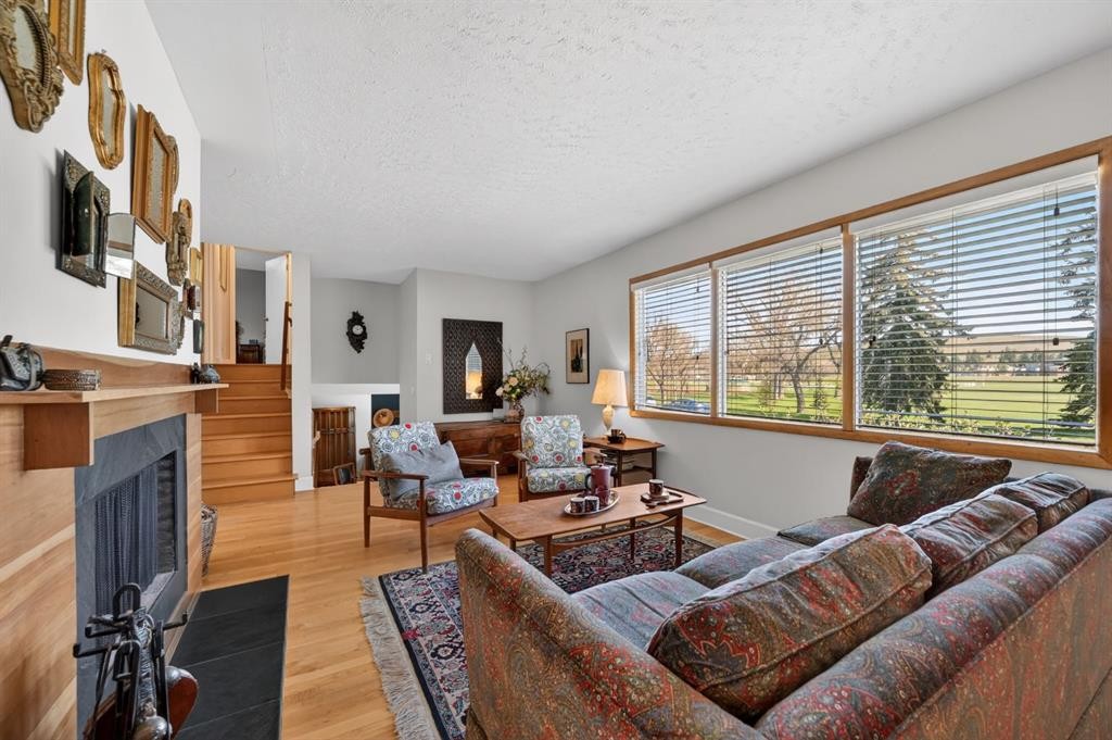 3811 24 Street Nw, Calgary, AB - Indoor Photo Showing Living Room With Fireplace