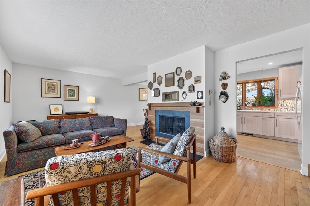 3811 24 Street Nw, Calgary, AB - Indoor Photo Showing Living Room With Fireplace