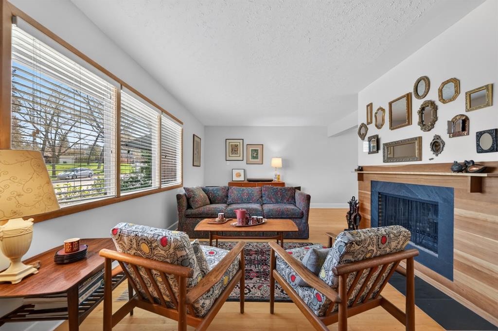 3811 24 Street Nw, Calgary, AB - Indoor Photo Showing Living Room With Fireplace