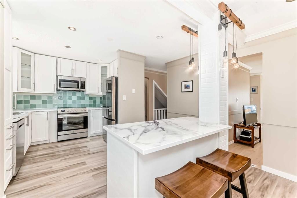 8-714 Willow Park Drive Se, Calgary, AB - Indoor Photo Showing Kitchen With Stainless Steel Kitchen With Upgraded Kitchen