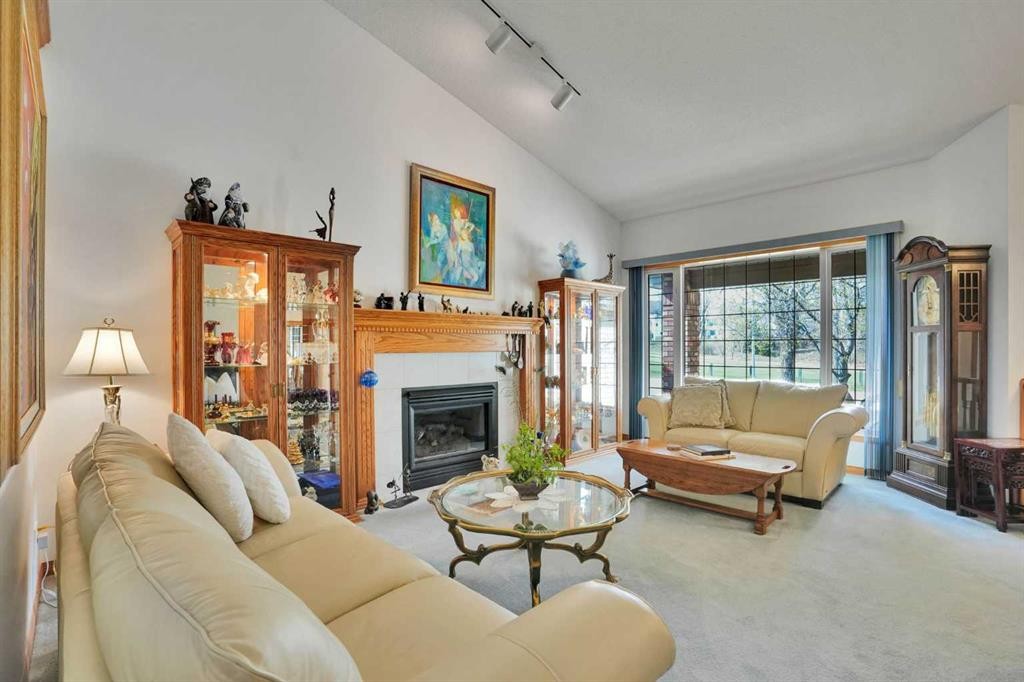 82 Valley Ridge Point Nw, Calgary, AB - Indoor Photo Showing Living Room With Fireplace