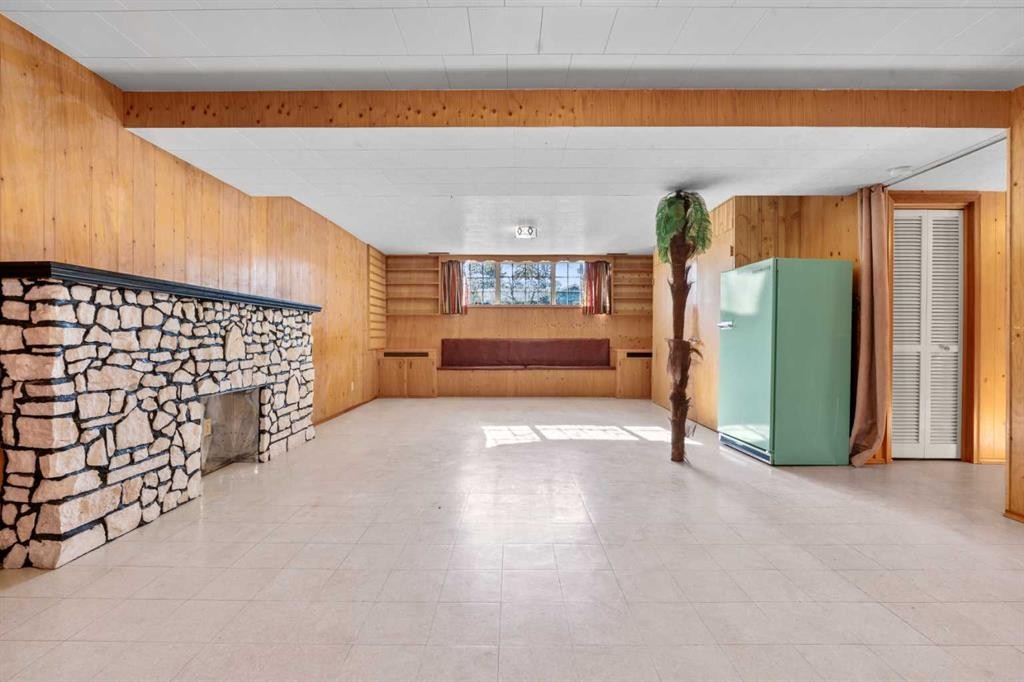 444 Woodland Crescent Se, Calgary, AB - Indoor Photo Showing Other Room With Fireplace