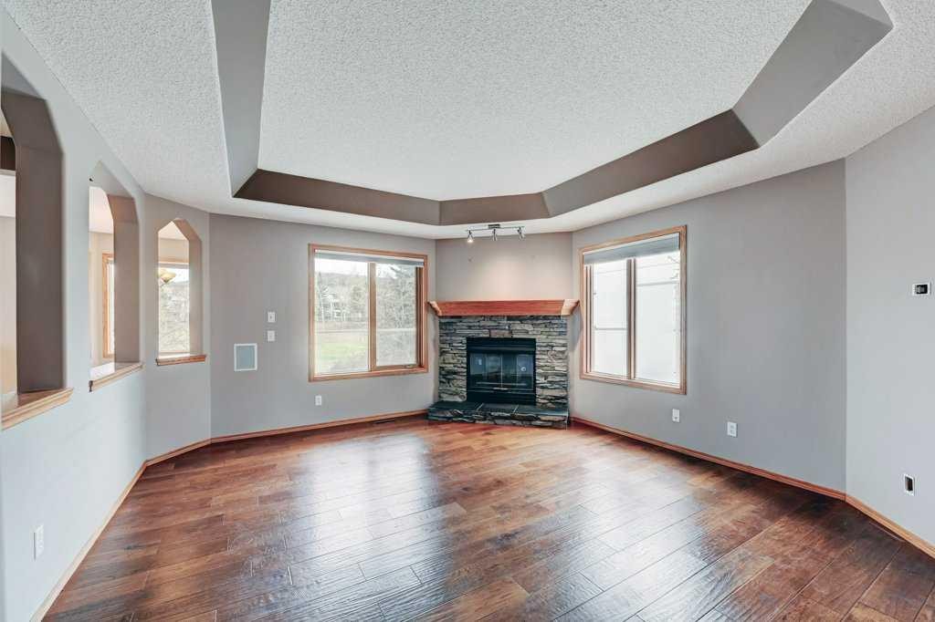 91 Valley Ridge Green Nw, Calgary, AB - Indoor Photo Showing Living Room With Fireplace