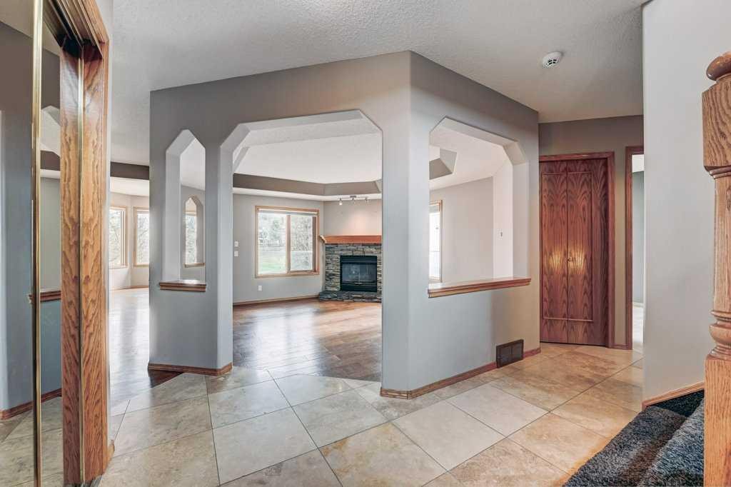 91 Valley Ridge Green Nw, Calgary, AB - Indoor Photo Showing Other Room With Fireplace