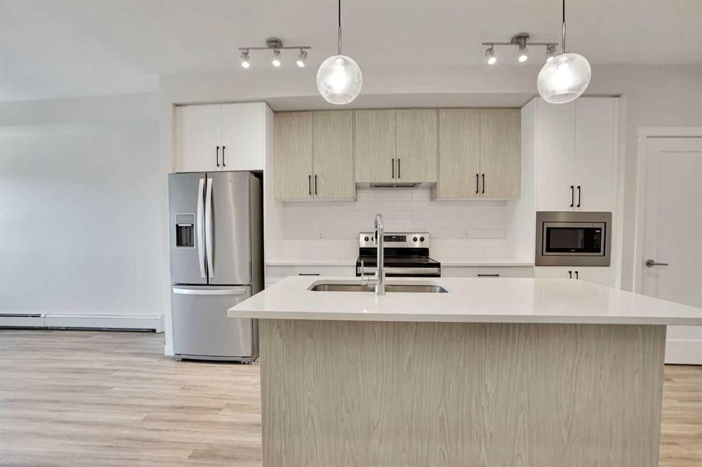 405-138 Sage Valley Common Nw, Calgary, AB - Indoor Photo Showing Kitchen With Stainless Steel Kitchen With Double Sink With Upgraded Kitchen