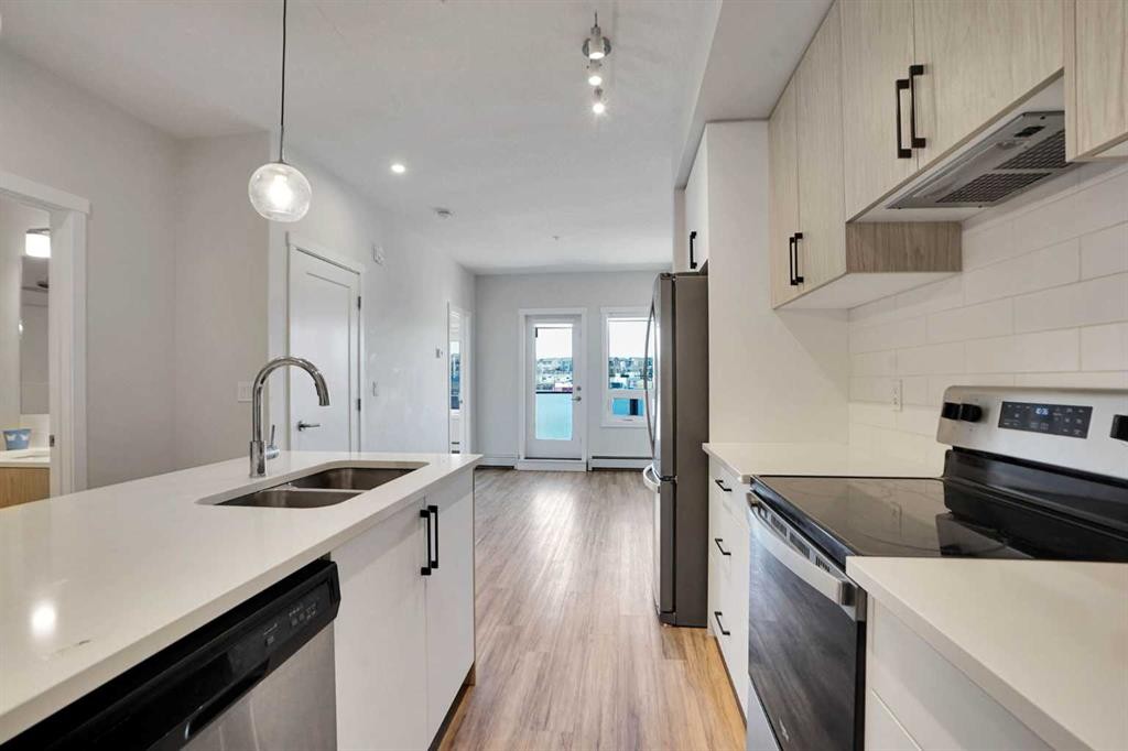 405-138 Sage Valley Common Nw, Calgary, AB - Indoor Photo Showing Kitchen With Stainless Steel Kitchen With Double Sink With Upgraded Kitchen