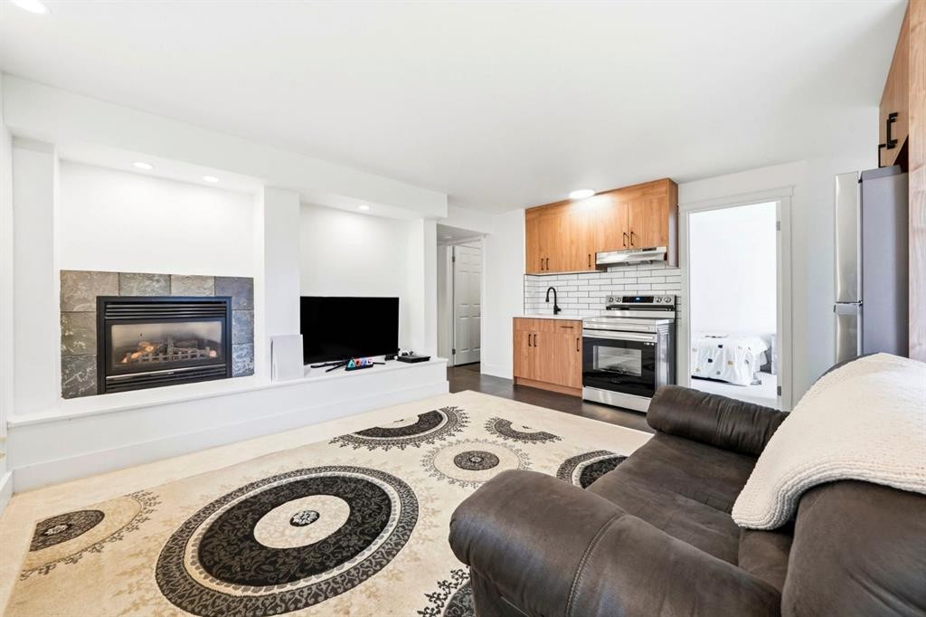 193 Hidden Creek Road Nw, Calgary, AB - Indoor Photo Showing Living Room With Fireplace