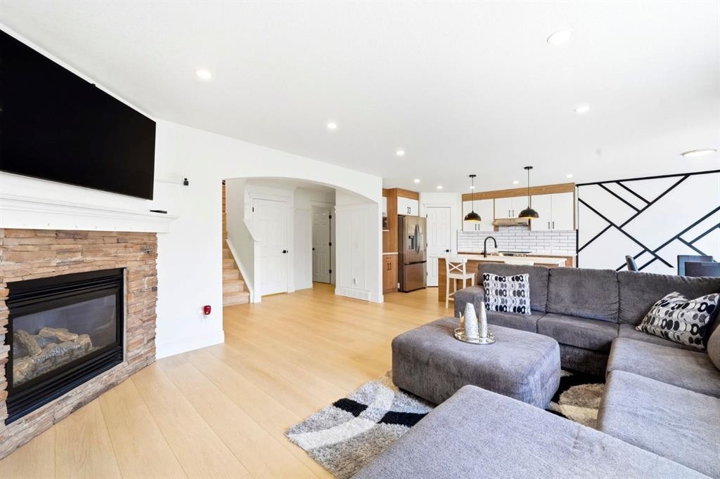 193 Hidden Creek Road Nw, Calgary, AB - Indoor Photo Showing Living Room With Fireplace