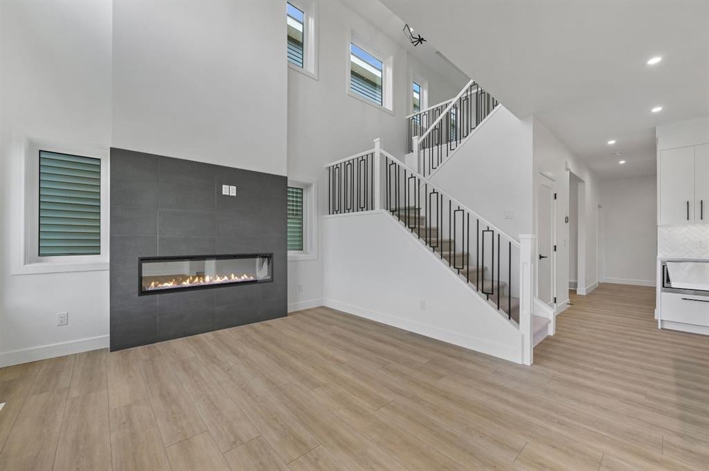 135 Walgrove Bay Se, Calgary, AB - Indoor Photo Showing Living Room With Fireplace