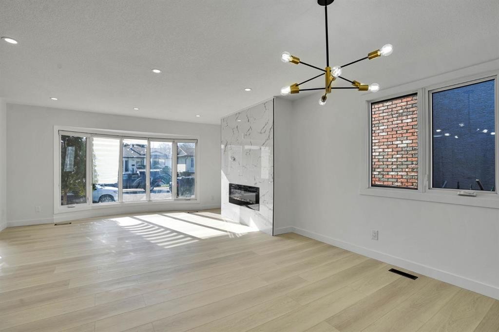 20 Templehill Crescent Ne, Calgary, AB - Indoor Photo Showing Other Room With Fireplace