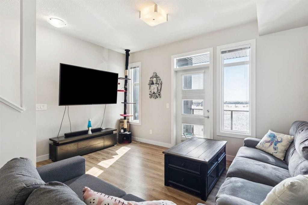116 Seton Passage Se, Calgary, AB - Indoor Photo Showing Living Room