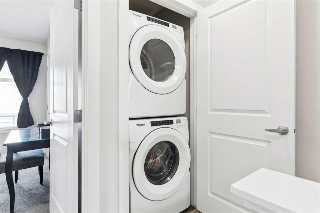 116 Seton Passage Se, Calgary, AB - Indoor Photo Showing Laundry Room