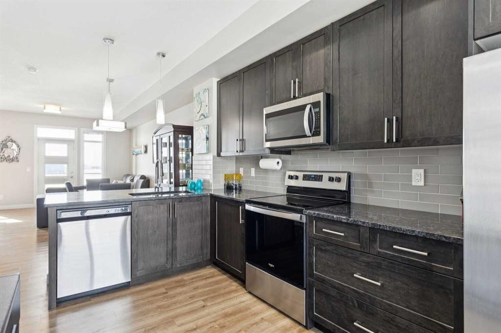 116 Seton Passage Se, Calgary, AB - Indoor Photo Showing Kitchen With Stainless Steel Kitchen With Upgraded Kitchen