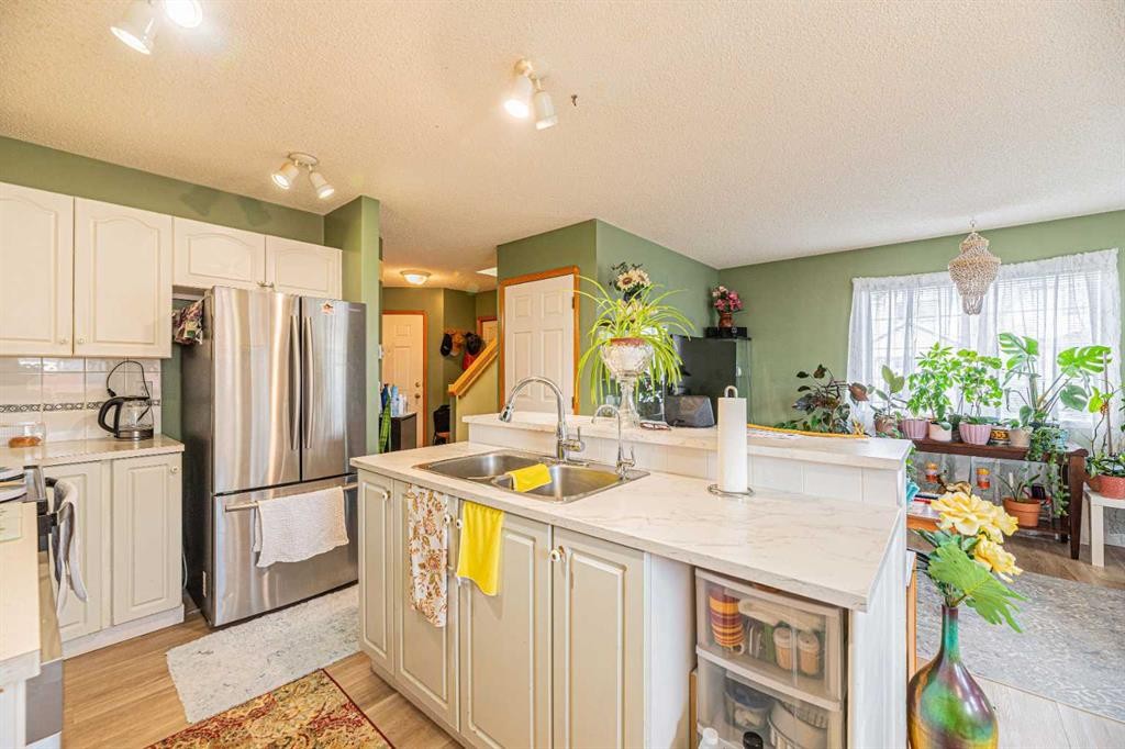 18 Coral Springs Circle Ne, Calgary, AB - Indoor Photo Showing Kitchen With Double Sink