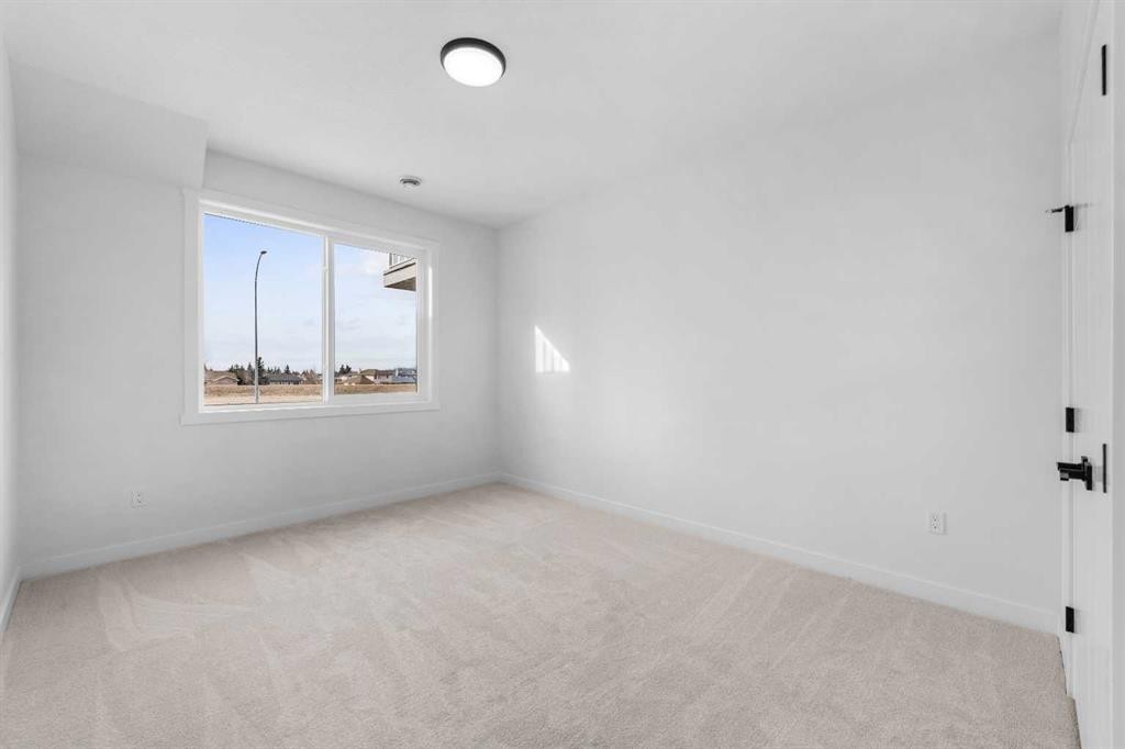 19 Wolf Crescent, Okotoks, AB - Indoor Photo Showing Other Room