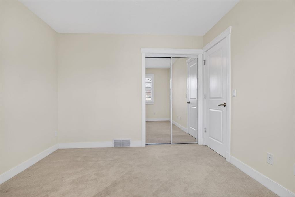24 Ypres Mews Sw, Calgary, AB - Indoor Photo Showing Other Room