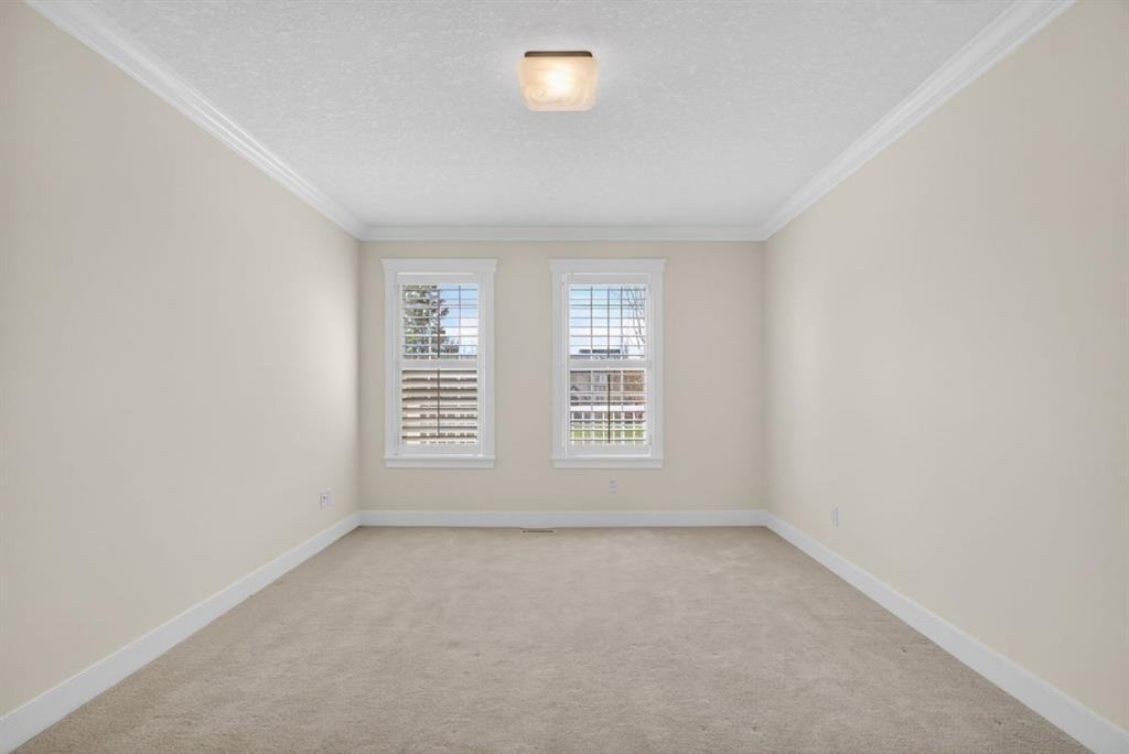 24 Ypres Mews Sw, Calgary, AB - Indoor Photo Showing Other Room