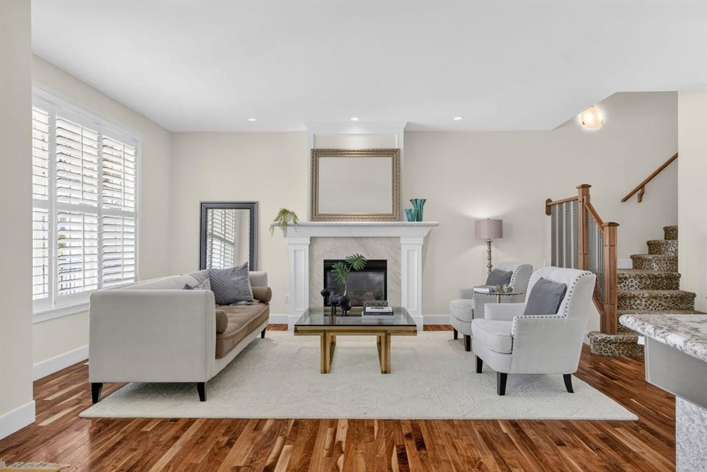 24 Ypres Mews Sw, Calgary, AB - Indoor Photo Showing Living Room With Fireplace