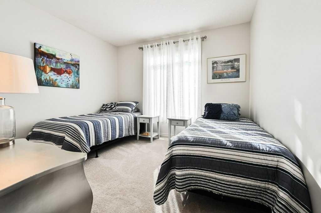 56 Discovery Woods Villas Sw, Calgary, AB - Indoor Photo Showing Bedroom