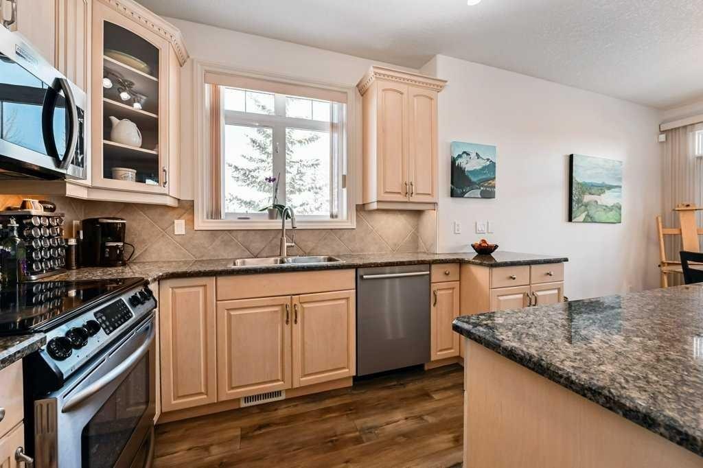 56 Discovery Woods Villas Sw, Calgary, AB - Indoor Photo Showing Kitchen With Stainless Steel Kitchen With Double Sink