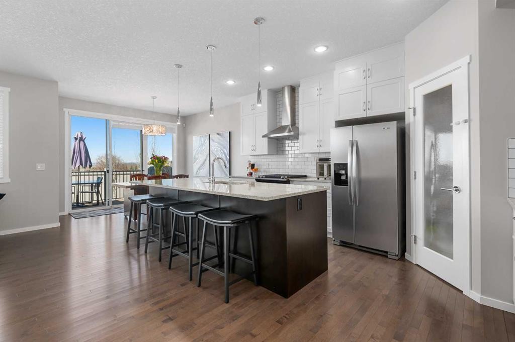 49 Tuscany Ridge Circle Nw, Calgary, AB - Indoor Photo Showing Kitchen With Stainless Steel Kitchen With Upgraded Kitchen