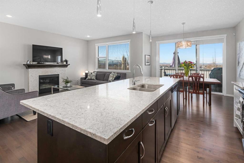 49 Tuscany Ridge Circle Nw, Calgary, AB - Indoor Photo Showing Kitchen With Fireplace With Double Sink With Upgraded Kitchen