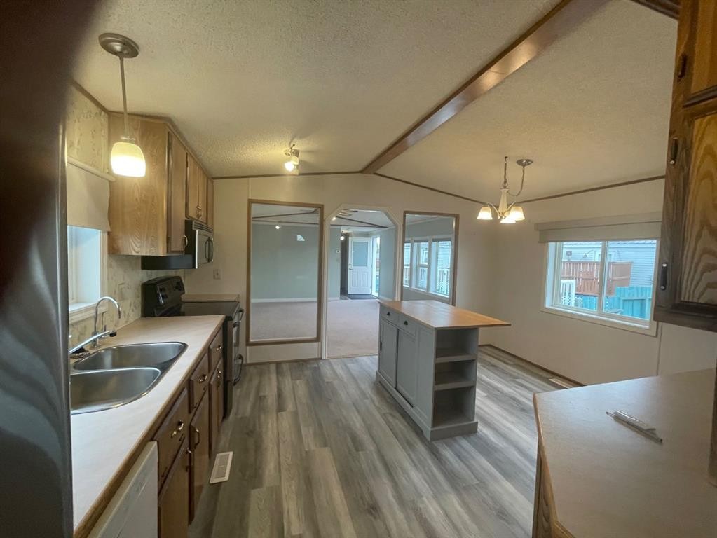12 Westover Crescent, Claresholm, AB - Indoor Photo Showing Kitchen With Double Sink