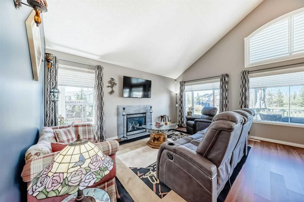 255 Copperfield Manor Se, Calgary, AB - Indoor Photo Showing Living Room With Fireplace