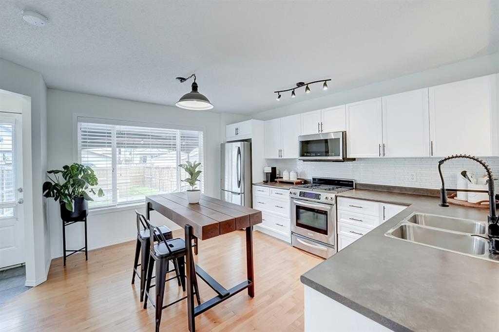 12 Elgin Meadows View Se, Calgary, AB - Indoor Photo Showing Kitchen With Double Sink