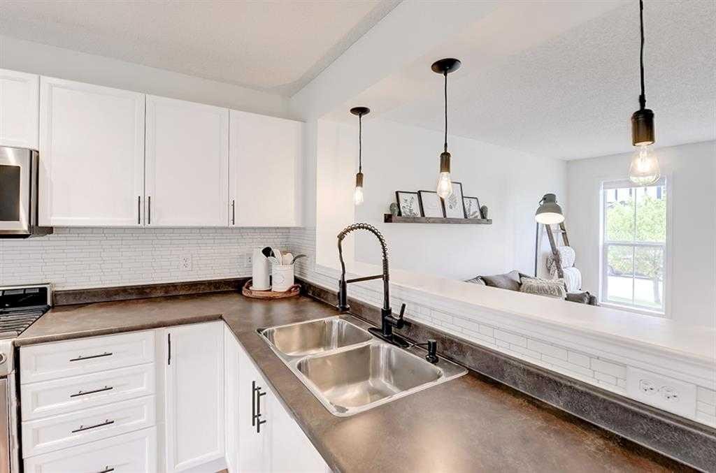 12 Elgin Meadows View Se, Calgary, AB - Indoor Photo Showing Kitchen With Double Sink