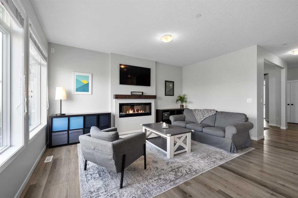 223 Howse Drive Ne, Calgary, AB - Indoor Photo Showing Living Room With Fireplace