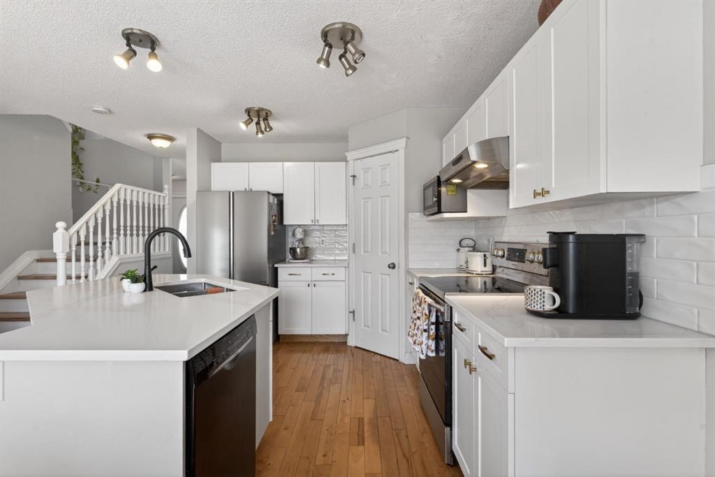 57 Bridlewood Manor Sw, Calgary, AB - Indoor Photo Showing Kitchen With Upgraded Kitchen