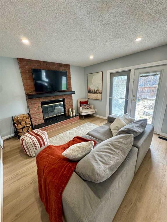 16 Woodfield Court Sw, Calgary, AB - Indoor Photo Showing Living Room With Fireplace