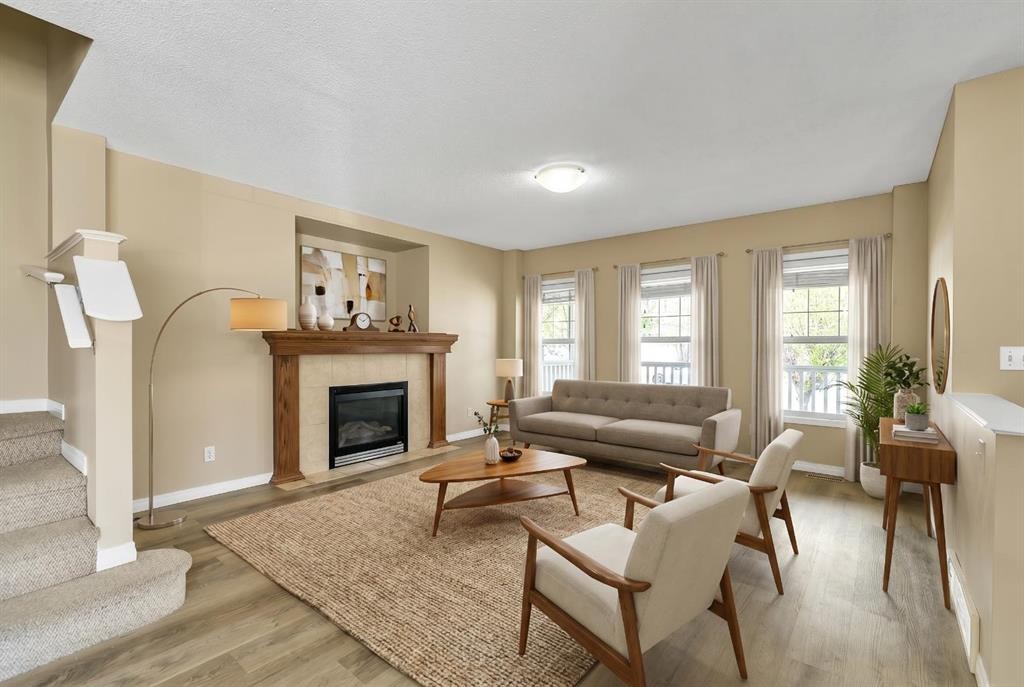 247 Evermeadow Avenue Sw, Calgary, AB - Indoor Photo Showing Living Room With Fireplace