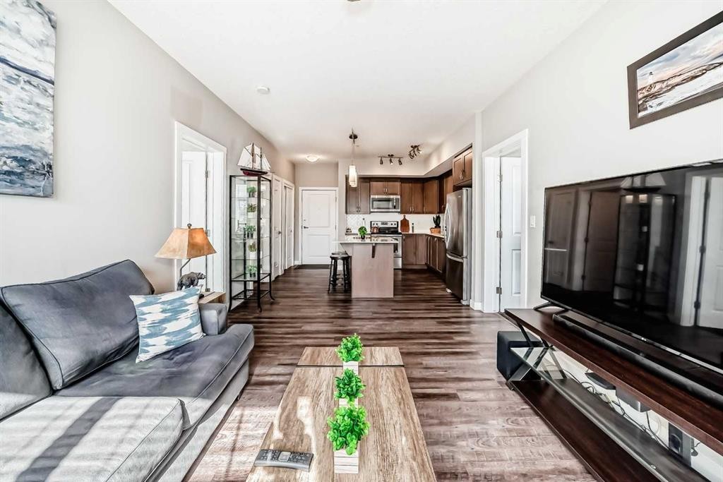 1212-3727 Sage Hill Drive Nw, Calgary, AB - Indoor Photo Showing Living Room